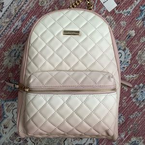 Perfect for travelling bookbag! Has a slit to slide onto your suitcase.